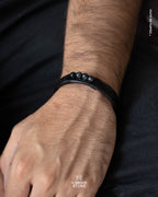 Pulsera Bjorn (Pulsera de Cuero Negro con Piedra Ojo de Halcón)